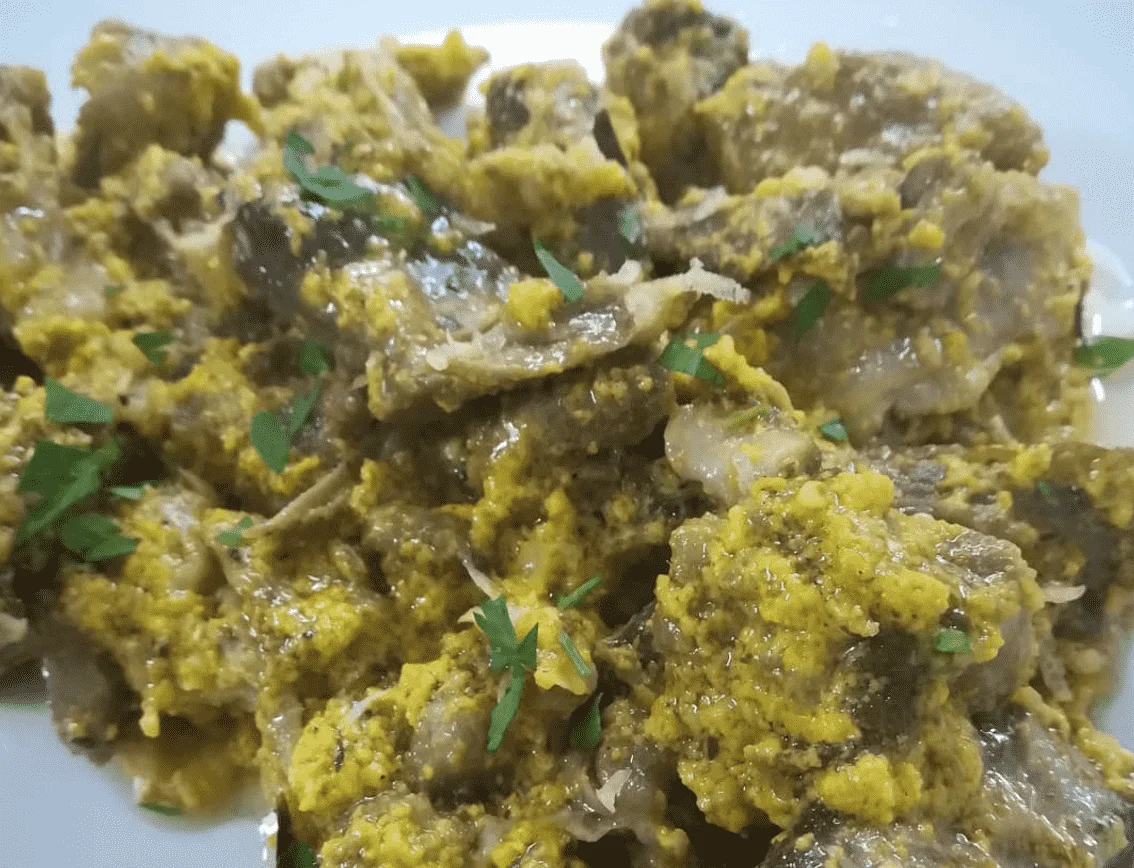 Sicilian lamb fricassee served with creamy sauce and fresh parsley