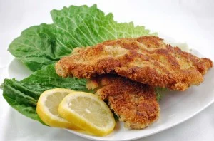 Palermitan-style breaded veal cutlets on a ceramic plate