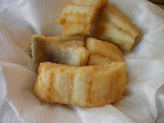 Golden Sicilian fried salt cod arranged on a serving platter