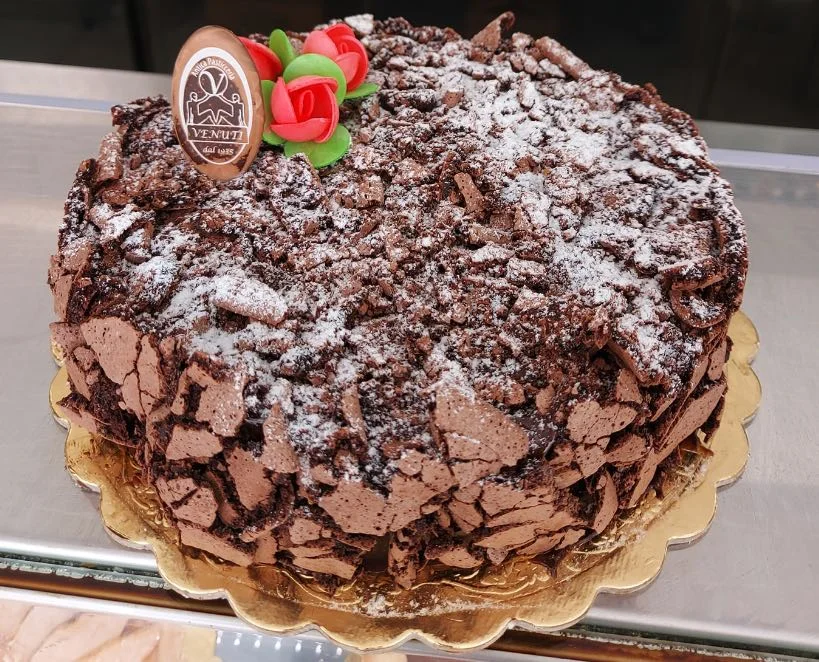 Messina black and white dessert topped with chocolate shards