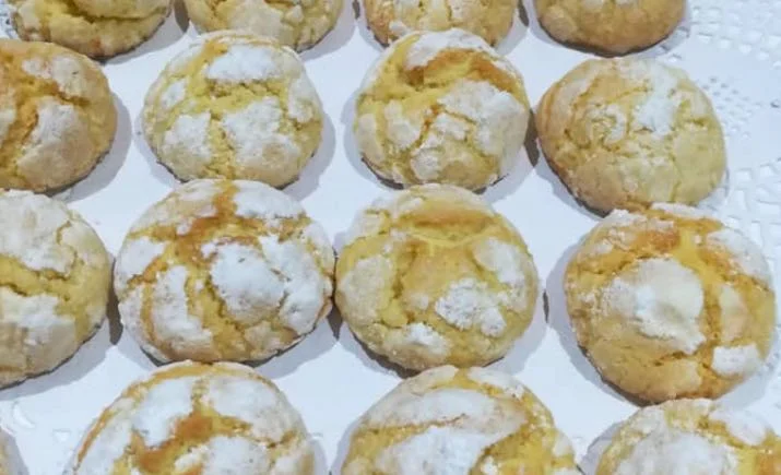 Soft Sicilian orange biscuits dusted with icing sugar on a plate