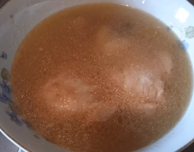 Sicilian mutton broth served steaming in a traditional ceramic bowl