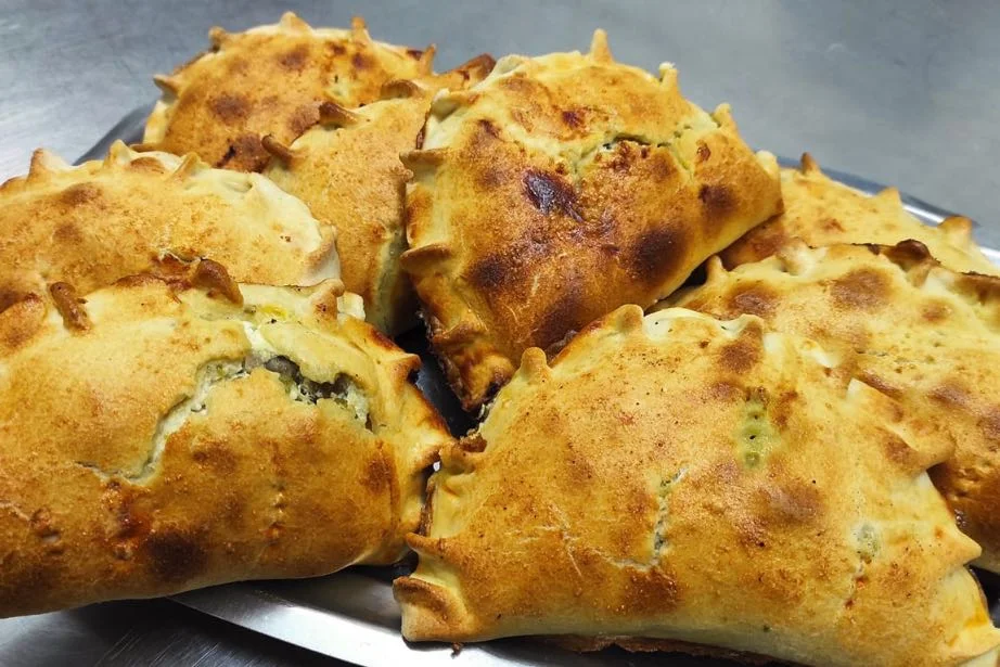 Traditional Modican buccateddi filled with sausage and broccoli