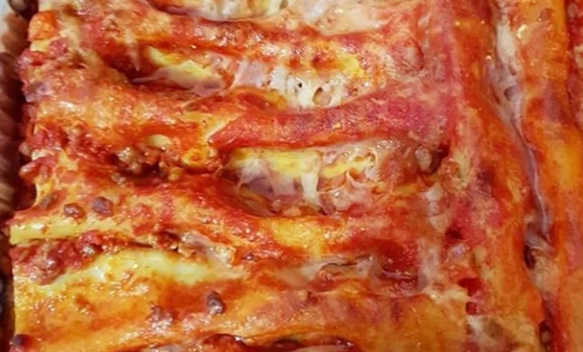 Sicilian meat cannelloni baked until golden in a ceramic dish