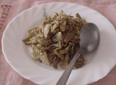 Sicilian-style lemon artichokes served warm in a ceramic dish