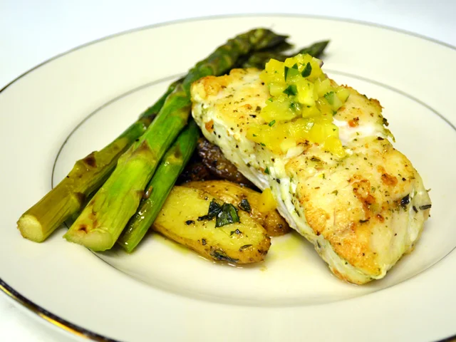 Grouper steaks grilling over open flame