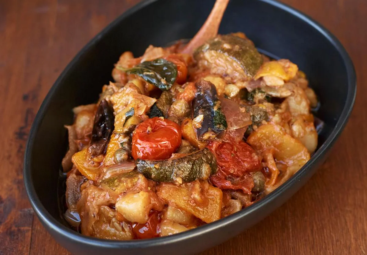 Ciaki ciuka from Pantelleria baked with colourful vegetables, almonds and capers