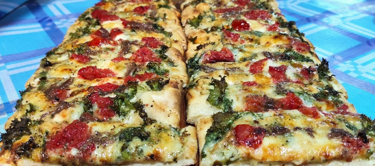 Messina-Style Focaccia: A Timeless Classic with Tuma Cheese, Tomatoes & Chicory