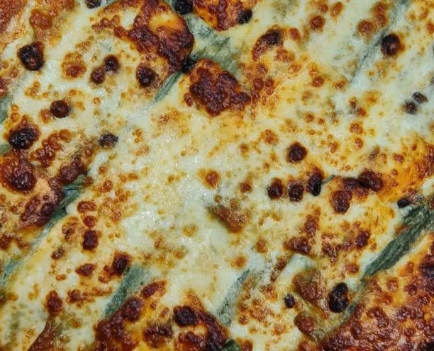 Sicilian cardoon bake served on decorated ceramic plate